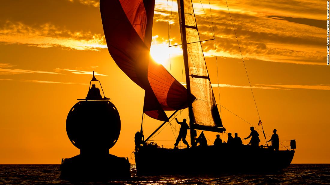 Sander Van der Borch photographed the silhouetted crew of Xenia preparing to turn the boat  around the mark during the Hague Offshore Worlds race.