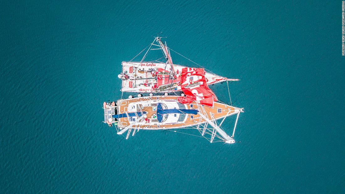 Ugo Fonolllá pictured two boats alongside one another as the crew prepare the mainsail with help of a support boat during the Volvo Ocean Race. &quot;The challenge with this picture was to get some symmetry with the masts of both boats,&quot; he says.