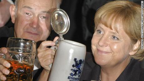 Bavaria&#39;s State Premier Guenther Beckstein toasts with Angela Merkel during the Berlin version &quot;Oktoberfest&quot; in 2008