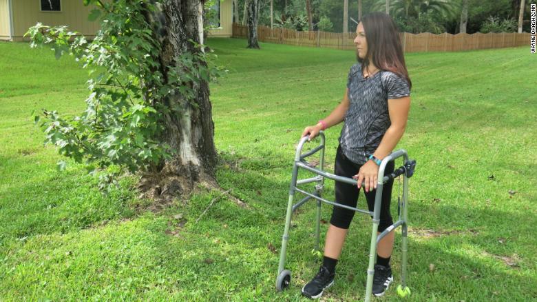Thomas stands next to the red maple where the truck she was driving came to a halt. &quot;The stimulator is facilitating my movement,&quot; she says, &quot;but my strength is coming from within.&quot;