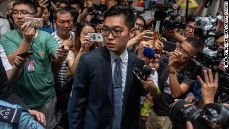 Andy Chan, founder of the Hong Kong National Party, surrounded by media as he leaves the Foreign Correspondents' Club (FCC) in Hong Kong on August 14, 2018. 