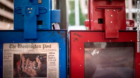 A Washington Post newspaper box (L) stands beside the empty box of competitor Washington Times (R) outside the Washington Post on August 5, 2013 in Washington, DC, after it was announced that Amazon.com founder and CEO Jeff Bezos had agreed to purchase the Post for USD 250 million.  Multi-billionaire Bezos, who created Amazon, which has soared in a few years to a dominant position in online retailing, said he was buying the Post in his personal capacity and hoped to shepherd it through the evolution away from traditional newsprint.   AFP PHOTO/Brendan SMIALOWSKI        (Photo credit should read BRENDAN SMIALOWSKI/AFP/Getty Images)