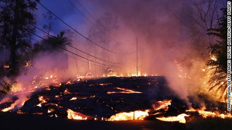 Lava from a Kilauea volcano fissure advances up a residential street in Leilani Estates, Hawaii, on May 27.