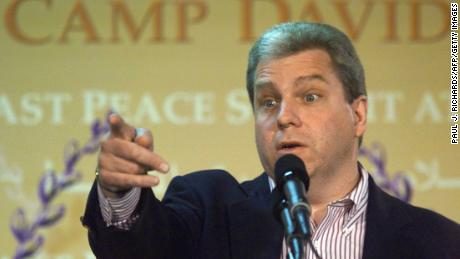 White House Press Secretary Joe Lockhart briefs reporters on July 12, 2000, on the Middle East peace summit at Camp David.