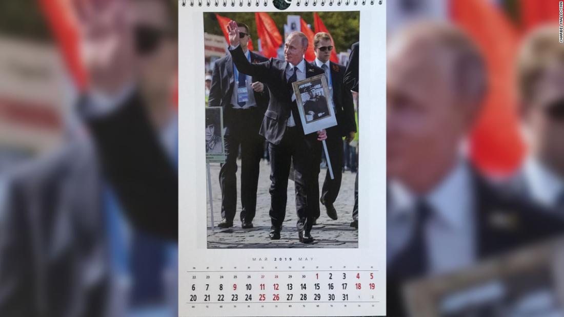 The picture for May is of a more formal Putin with heavy security.
