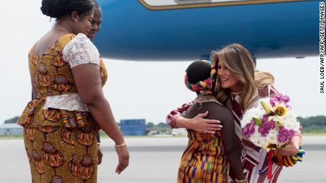 Melania Trump receives flowers during an arrival ceremony after landing at Kotoka International Airport in Accra, Ghana, on Tuesday.