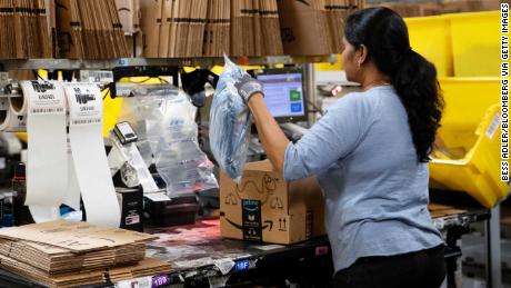 An employee packs a box at the Amazon fulfillment center in Robbinsville, New Jersey.