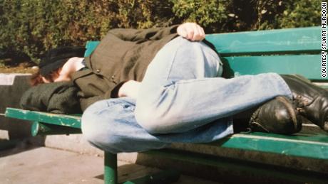 Stuart Murdoch rests on a park bench during a visit to the United States.