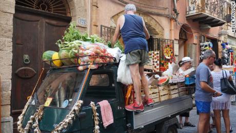 Sometimes the market comes to you. Fresh fruit and vegetables sold off a cart in Cefalu Sicily.