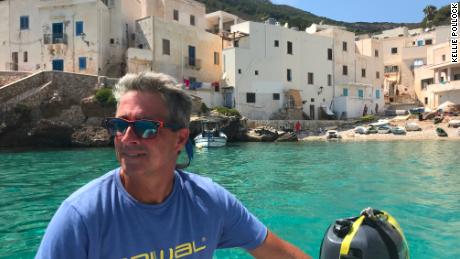 Jonathan steers the dinghy back to the boat after a shopping trip to Levanzo in Sicily's Egadi Islands. There was just one small grocery store on this island and it had sold out of fresh milk and bread.