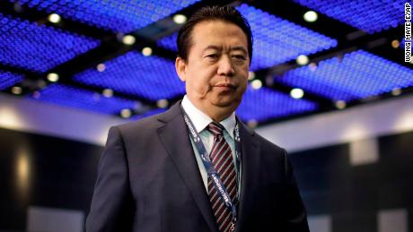 Interpol President, Meng Hongwei, walks towards the stage to deliver his opening address at the Interpol World congress on Tuesday, July 4, 2017, in Singapore. (AP Photo/Wong Maye-E)