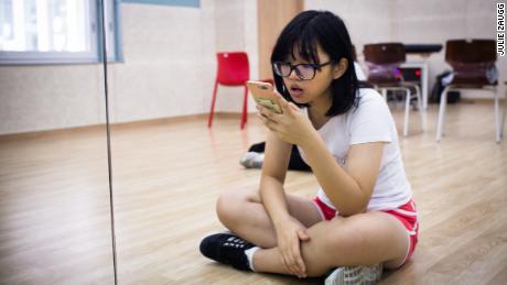 Yang Fang Chi, 17 years old, practices her singing before class at Global K.  