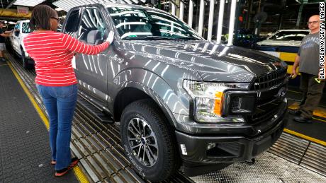 Ford will trim jobs in workforce reorganization 