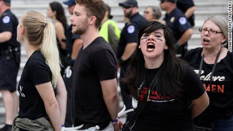 U.S. Capitol Police arrest protesters on the steps of the Capitol before a scheduled vote on the confirmation of Supreme Court nominee Judge Brett Kavanaugh.