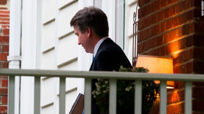 Supreme Court nominee Brett Kavanaugh departs his home, enroute the Supreme Court to be sworn-in as an Associate Justice, in Chevy Chase, Md., Saturday, Oct. 6, 2018. (AP Photo/Cliff Owen)