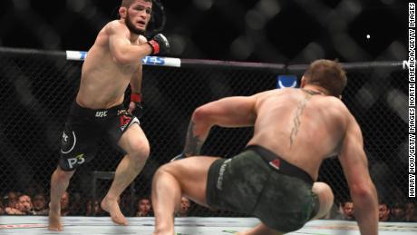 Nurmagomedovchases down McGregor of Ireland in their UFC lightweight championship bout.