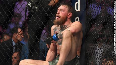 Conor McGregor sits on the mat in the octagon after being defeated by Khabib Nurmagomedov by submission on October 6, 2018 in Las Vegas, US.