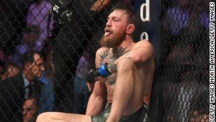 Conor McGregor sits on the mat in the octagon after being defeated by Khabib Nurmagomedov by submission on October 6, 2018 in Las Vegas, US.