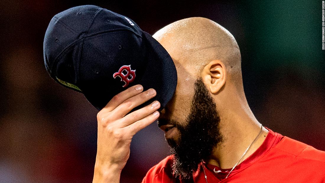 David Price of the Boston Red Sox covers his face with his cap as he exits the game during the second inning of game two of the American League Division Series against the New York Yankees on October 6, 2018 at Fenway Park in Boston, Massachusetts. Price was credited with the loss as the Yankees went on to win the game and tie the series 1-1.