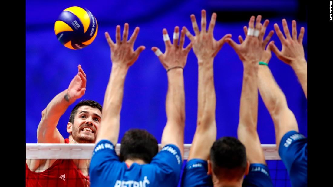 United States&#39; Matthew Anderson, left, spikes as Serbia&#39;s Nemanja Petric, Marko Podrascanin, and Drazen Luburic jump to block the ball during the 2018 FIVB Men&#39;s World Championship&#39;s third place match between USA and Serbia, in Turin, Italy, Sunday, Sept. 30, 2018.