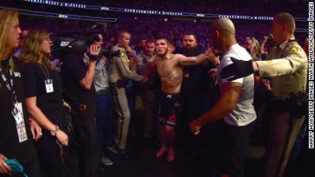  Khabib Nurmagomedov of Russia is escorted out of the arena after defeating Conor McGregor.