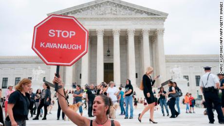 Alessandra Mondolfi joins fellow protesters against US Supreme Court nominee Brett Kavanaugh demonstrate at the US Supreme Court in Washington, DC, on October 6, 2018.