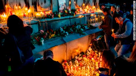 Bulgarians light candles during a vigil in memory of Viktoria Marinova in the city of Ruse on Monday.