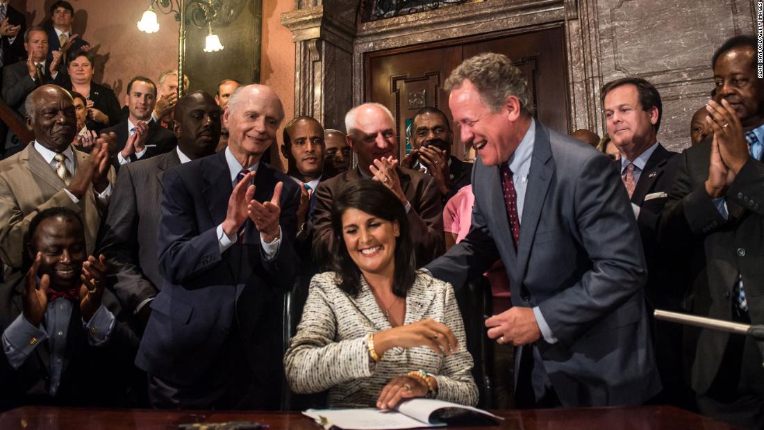 Haley signs a bill to remove the Confederate battle flag from the State House grounds.