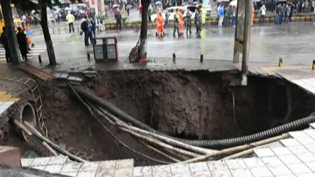 Massive sinkhole swallows up four pedestrians in China CNN