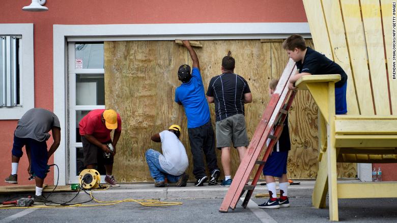 Workers boarded the windows of Marco&#39;s Pizza in Panama City Beach , Florida as Hurricane Michael approached Tuesday.  