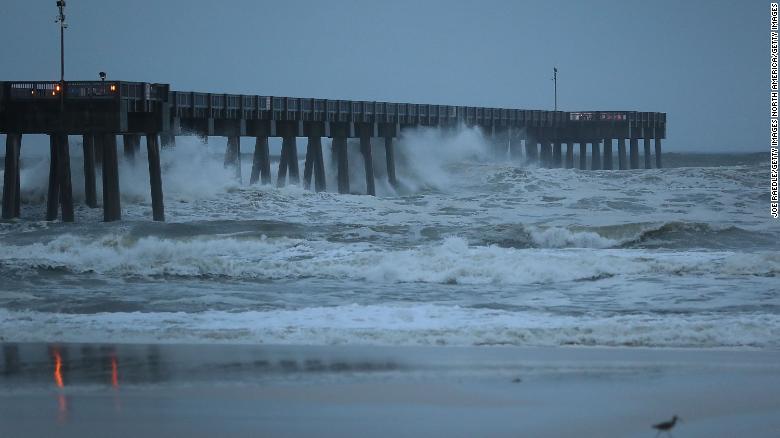 Waves crash along a pier in Panama City Beach, Florida, just hours before the expected landfall.