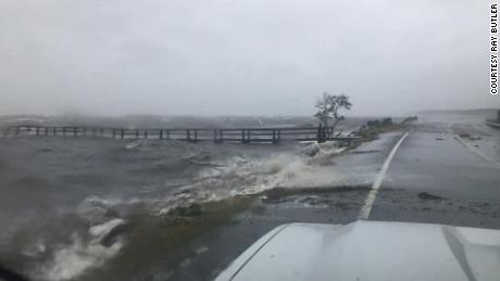 Seawater washes on to US 98 in Eastpoint, Florida, just east of Apalachicola.