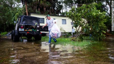 Mitchell Pope tries to salvage what he can from his mobile home Wednesday in St. Marks. 