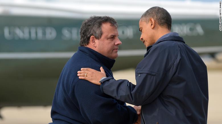 President Barack Obama is greeted by New Jersey Governor Chris Christie upon arriving in Atlantic City, New Jersey, on Oct. 31, 2012, to visit areas hardest hit by Sandy.