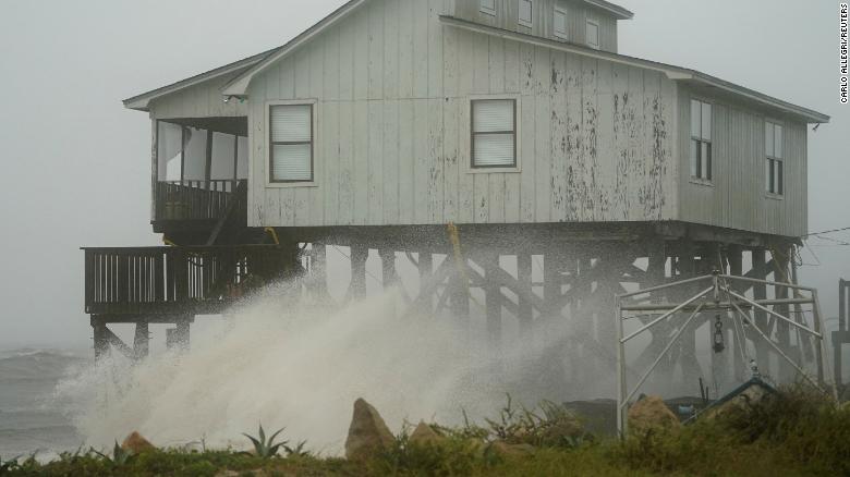 Waves take over a house as Hurricane Michael comes ashore in Alligator Point, Florida, U.S., October 10, 2018. REUTERS/Carlo Allegri