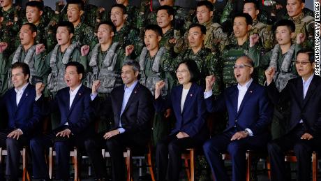 Taiwan&#39;s President Tsai Ing-wen (front row-3rd R) and visiting Paraguay President Mario Abdo Benitez attend a military drill in Taoyuan on October 9, ahead of National Day.