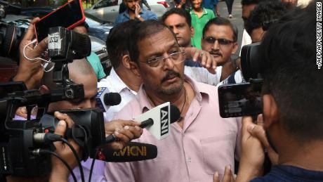 Indian Bollywood actor Nana Patekar is mobbed by the media as he leaves after making a statement outside his home in Mumbai on October 8, 2018. 