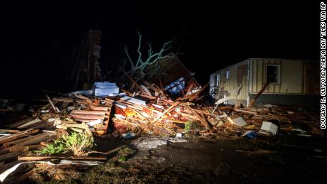 The hurricane leaves a trail of debris in Mexico Beach early Thursday. 