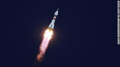 The Soyuz-FG rocket booster blasts off from the Baikonur Cosmodrome carrying the Soyuz MS-10 spacecraft and crew.