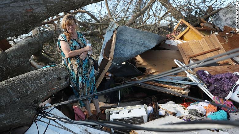 Kathy Coy looks at the remains of her Panama City home Thursday after Hurricane Michael destroyed it.