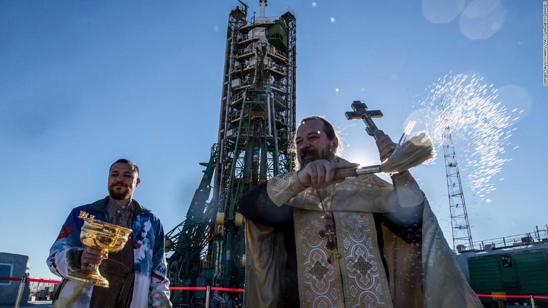 An Orthodox priest blesses the Soyuz-FG rocket booster launch site on Wednesday, October 10.