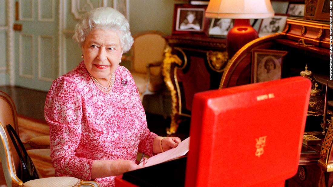 The Queen is seated at her desk in her private audience room at Buckingham Palace in July 2015. She is seen with one of her official red boxes, which contains important papers from government ministers in the United Kingdom and from representatives across the Commonwealth and beyond. The photo was taken to mark the moment the Queen became the longest-reigning British monarch.
