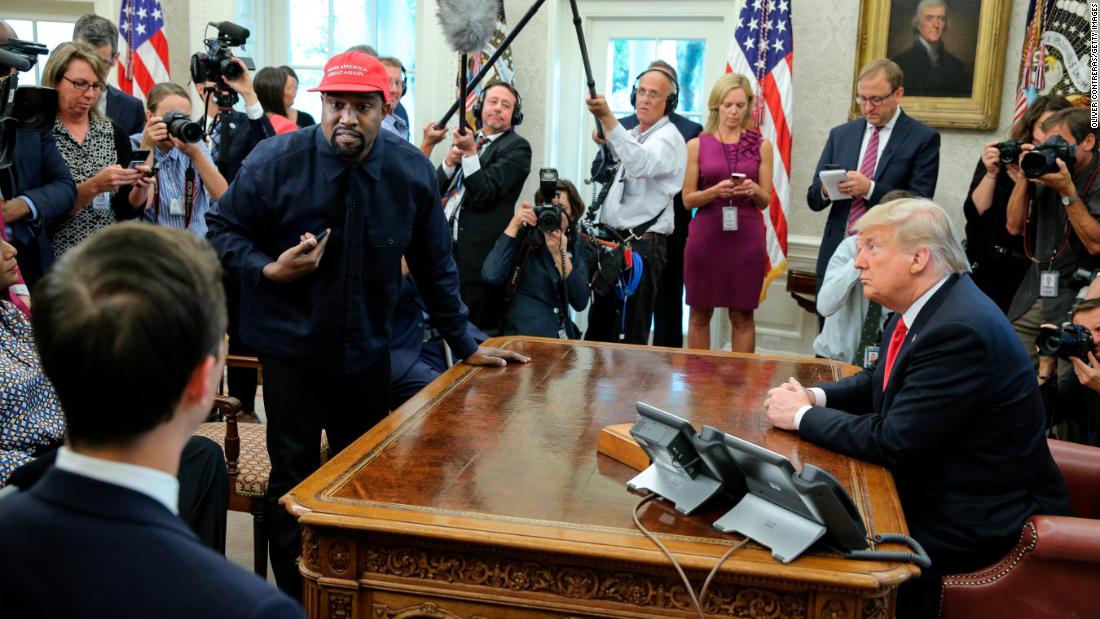 Rapper Kanye West stands up during his Oval Office meeting with Trump in October 2018. West and football legend Jim Brown &lt;a href=&quot;https://www.cnn.com/2018/10/11/politics/kanye-west-donald-trump-white-house-chicago/index.html&quot; target=&quot;_blank&quot;&gt;had been invited for a working lunch&lt;/a&gt; to discuss topics such as urban revitalization, workforce training programs and how best to address crime in Chicago. 