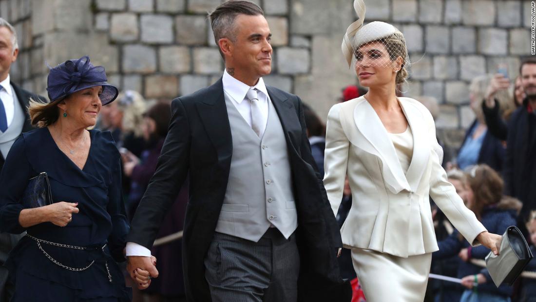 Singer Robbie Williams and film and television star Ayda Field, his wife, arrive ahead of the wedding.