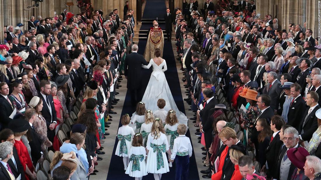 Prince Andrew walks his daughter Princess Eugenie of York down the aisle.