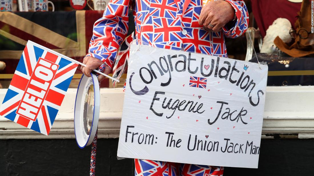 A fan of the royal family takes up a position outside Windsor Castle.