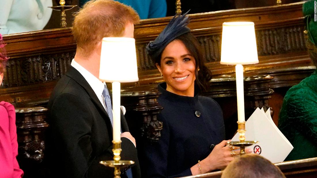 Prince Harry and Meghan, the Duke and Duchess of Sussex, wait for the ceremony to begin.