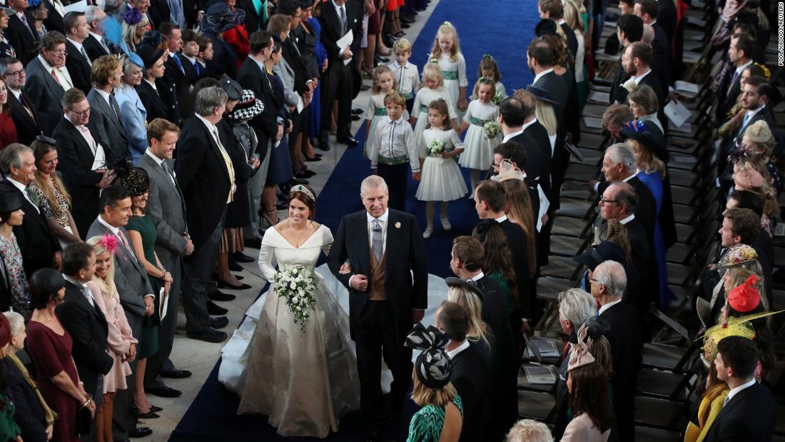 Princess Eugenie walks down the aisle with her father, Prince Andrew, the Duke of York.