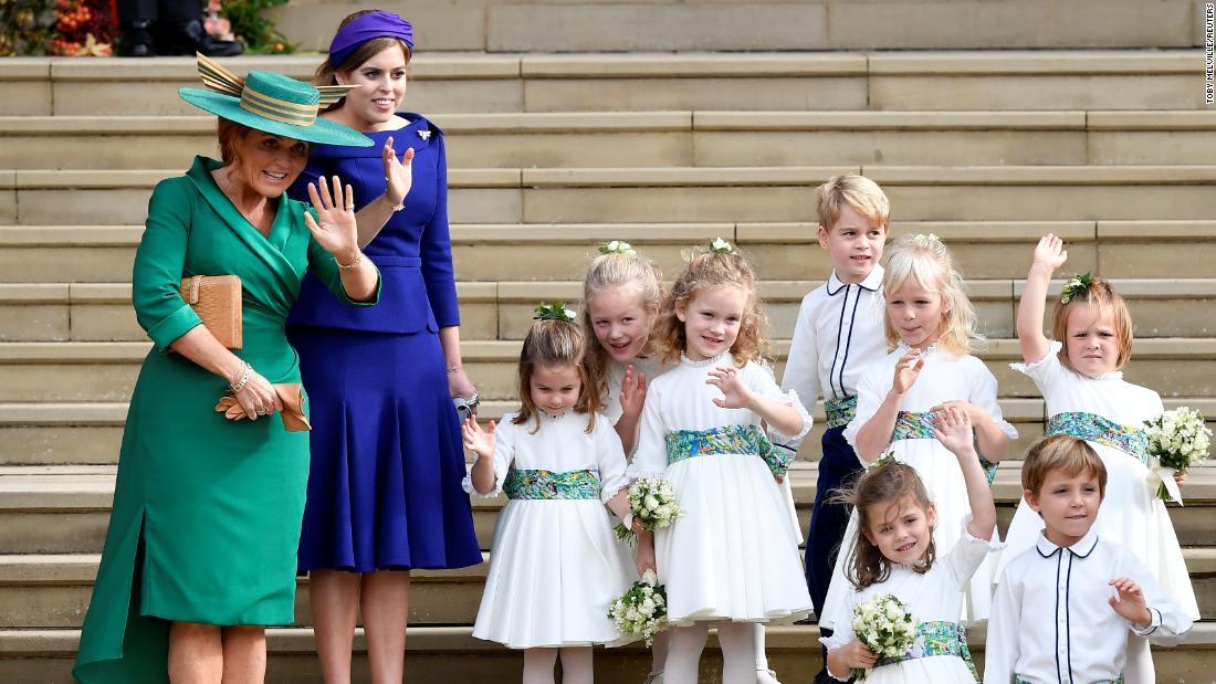 Sarah Ferguson, Princess Beatrice and the bridesmaids and page boys, including Prince George and Princess Charlotte, wave as the bride and groom depart from the chapel.