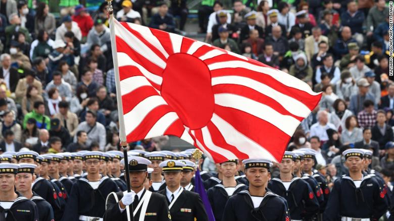 The flag of the Japan Maritime Self-Defense Force is seen in a military review at the Ground Self-Defence Force Asaka training ground in Asaka, Saitama prefecture on October 14, 2018. 